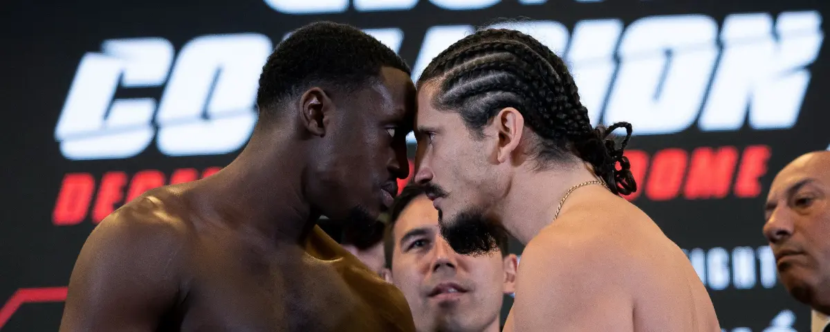GLORY Colission 9; Mory Kromah en Milos Cvjeticanin staan met het hoofd tegen elkaar aan tijdens de stare-down.